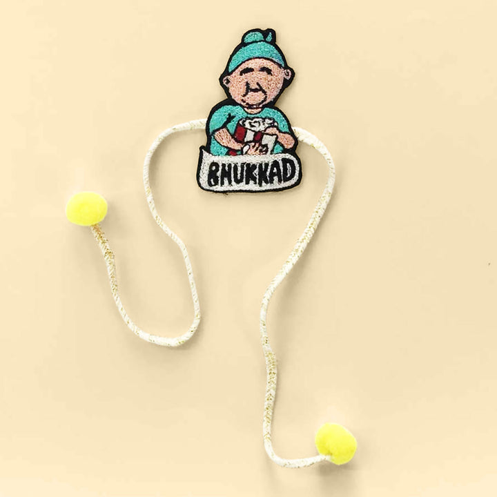 Handmade Bhukkad Pom Pom Felt Rakhi For Brother - Flat Lay Front View