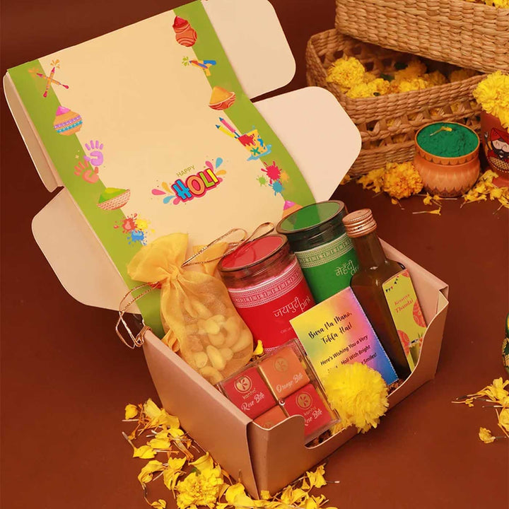 Blissful Holi Gift Box | Includes 2 Organic Color Jars, 1 Mix Nuts Potli, 4 Rose & Orange Bites in Acrylic Box, 1 Thandai, 1 Faux Marigold Flower, 1 Holi Card, 1 Corrugated Gift Box