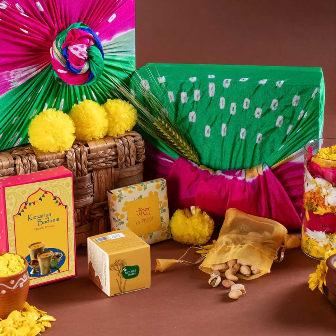 Holi Bliss in Yellow Gift Hamper | Includes 5 Faux Genda Flowers, 1 Yellow Gulaal, 1 Thandai, 1 Mix Dry Fruit Nuts, 1 Uptan Face Mask, 1 Kulhad, 1 Marigold Seeds Pack, 1 Classic Gift Box