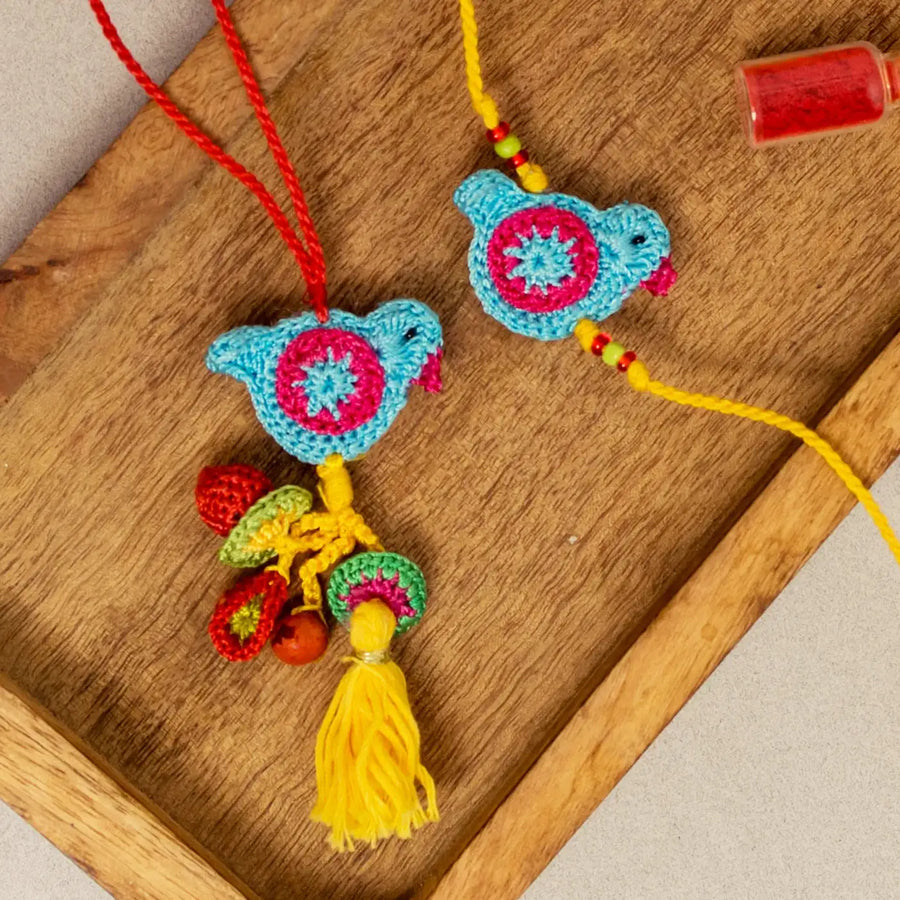 Handmade Crochet Blue Birds Bhaiya Bhabhi Rakhi With Roli Chawal Set Of 2 - Close-up of bird charms