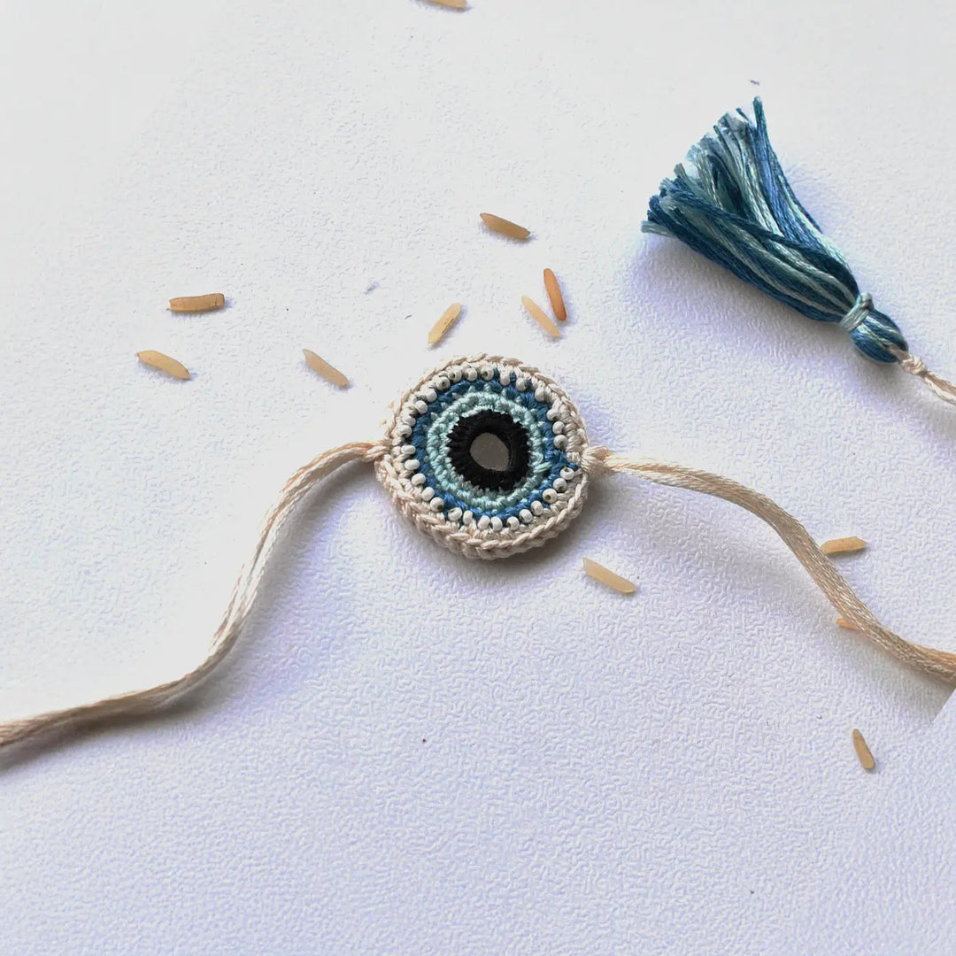 Handmade Crochet Blue Evil Eye Rakhi With Roli Chawal