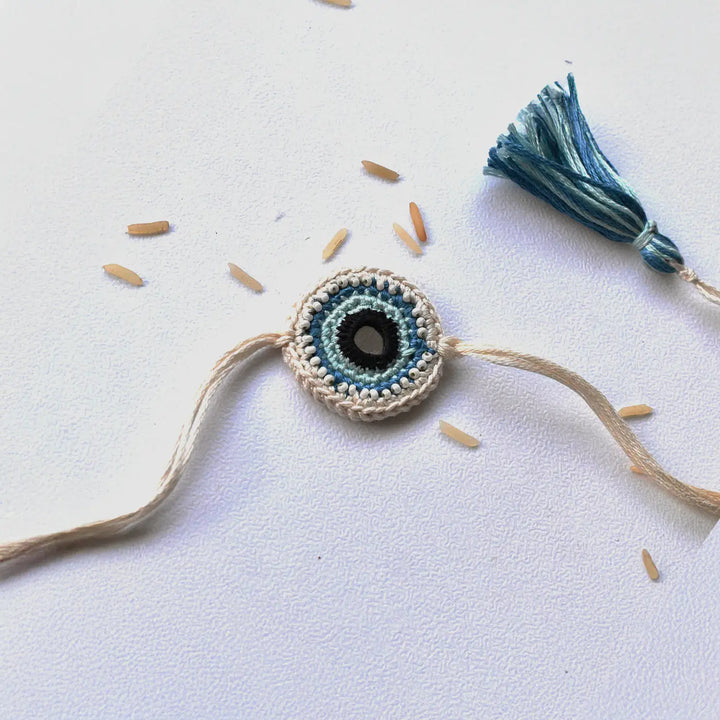 Handmade Crochet Blue Evil Eye Rakhi With Roli Chawal