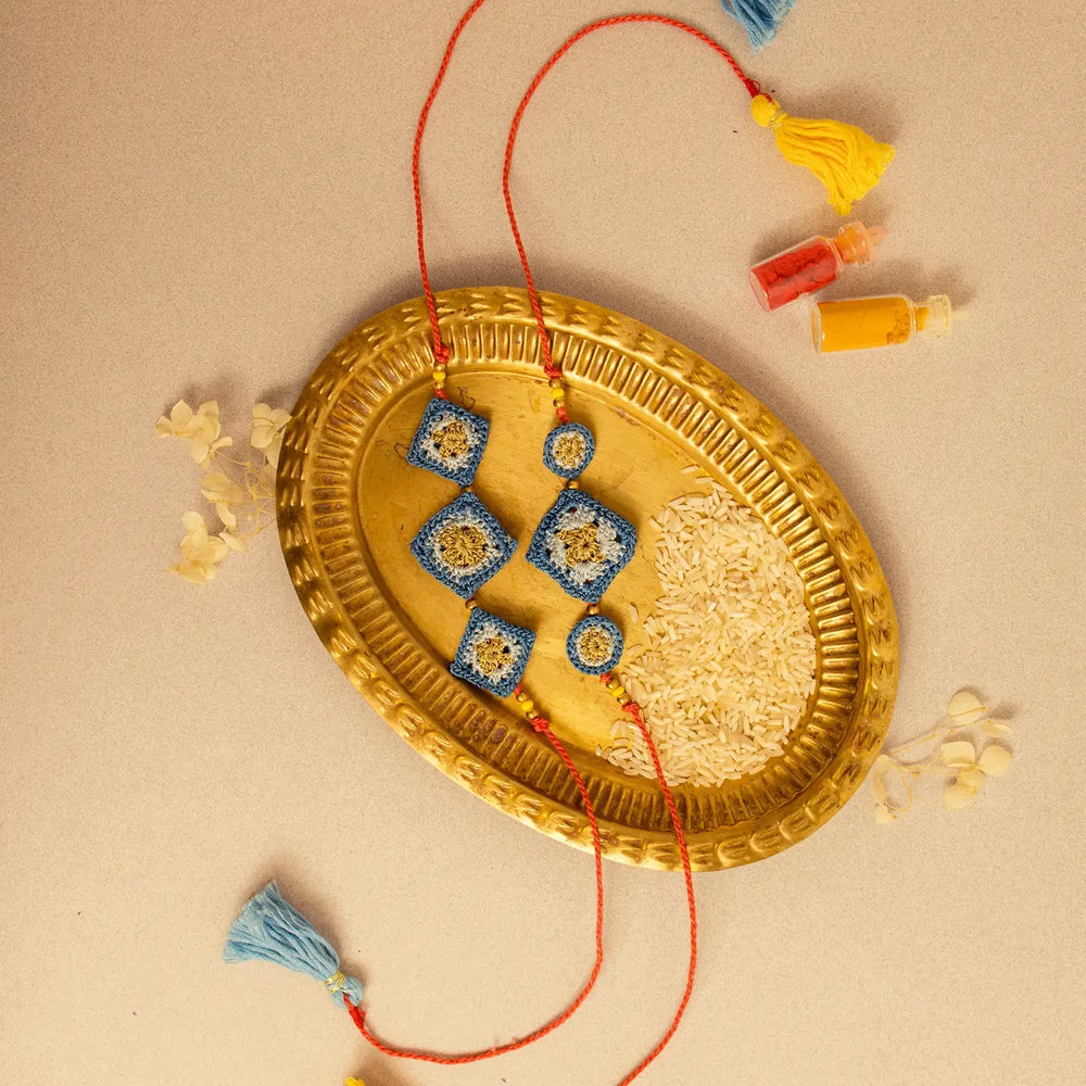 Handmade Crochet Trishla Rakhi With Roli Chawal Set Of 2 - Full product with accessories