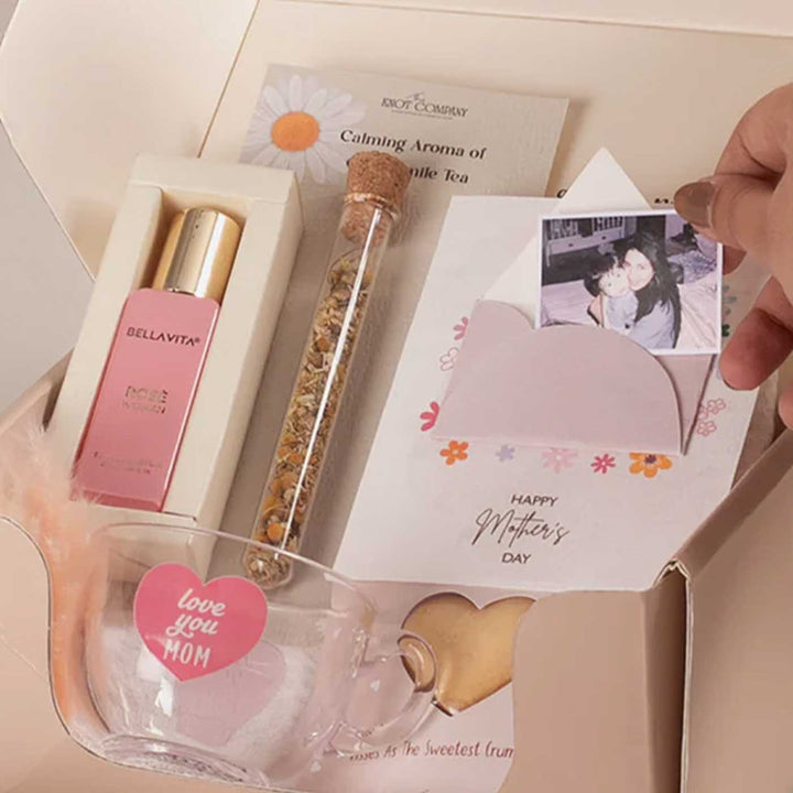 Photo Personalized Celebrating Mom’s Love Gift Hamper | Includes 1 Perfume, 4 Heart-Shaped Baked Cookies, 1 “Love You Mom” Glass Tea Cup, 1 Mother’s Day Card, 1 Chamomile Tea Glass Tube, 1 All Things Nice Gift Box