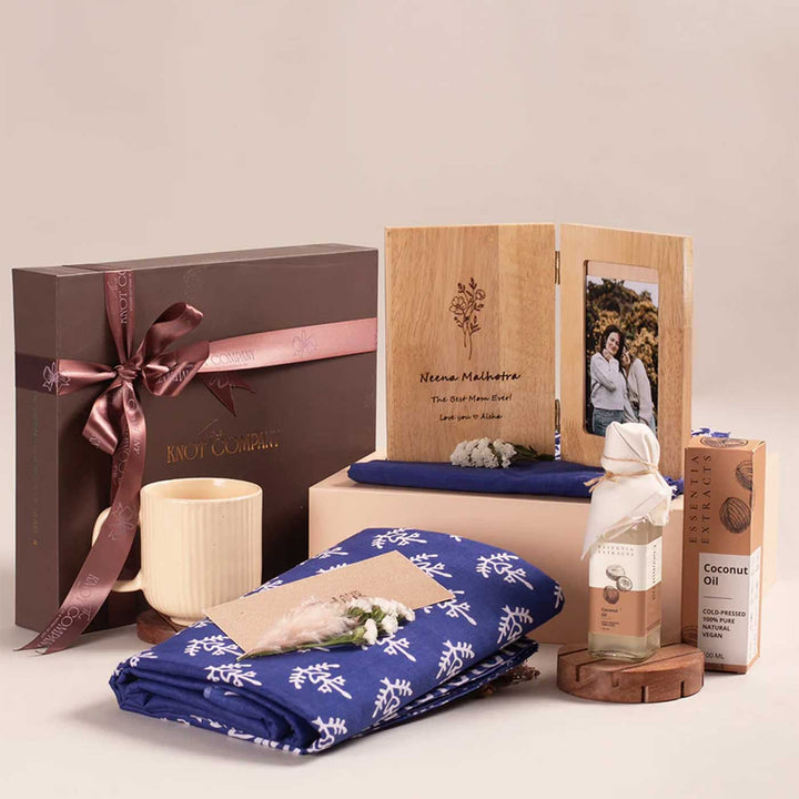 Photo Personalized For the Heart of Our Home Gift Hamper | Includes 1 Hand Block Printed Saree with Unstitched Blouse, 1 Wooden Photo Frame, 1 Ribbed & Glazed Ceramic Mug, 1 Coconut Oil, 1 Mother’s Day Handwritten Postcard, 1 Classic Gift Box