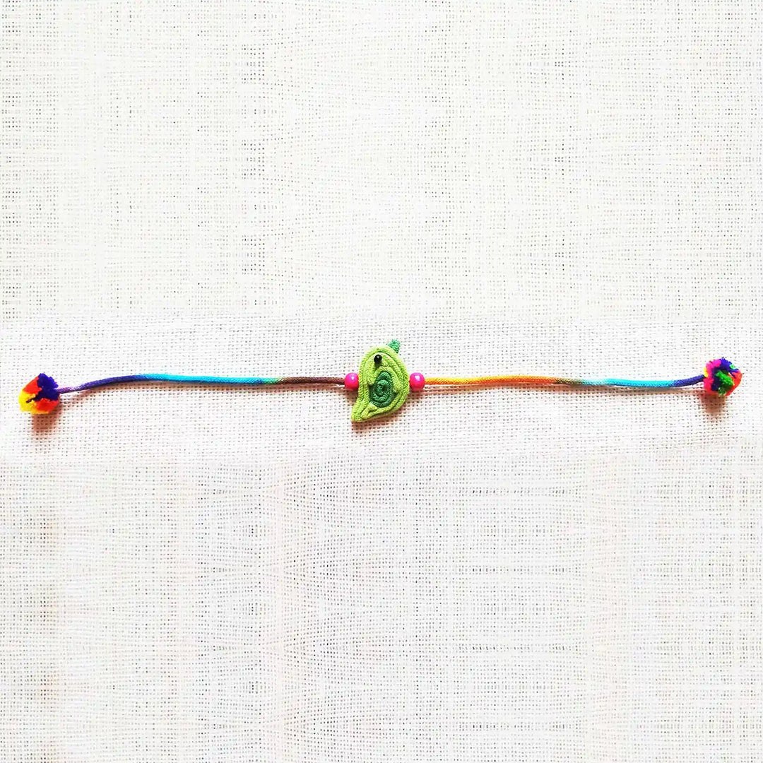 Handmade Dori Work Cute Bird Kids Rakhi With Roli Chawal - Full product laid flat