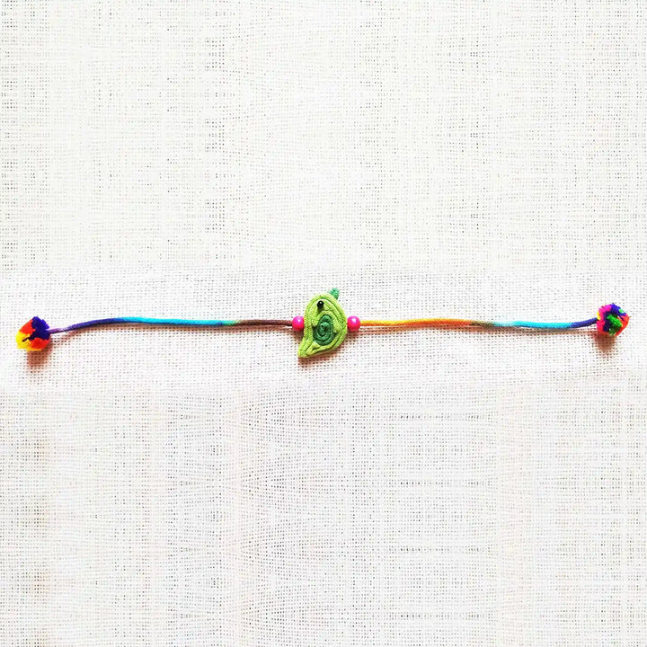 Handmade Dori Work Cute Bird Kids Rakhi With Roli Chawal - Full product laid flat