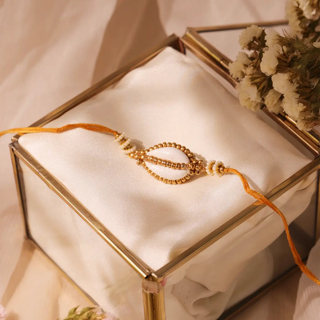 Handmade Beaded Golden Cowry Shell Rakhi With Roli Chawal