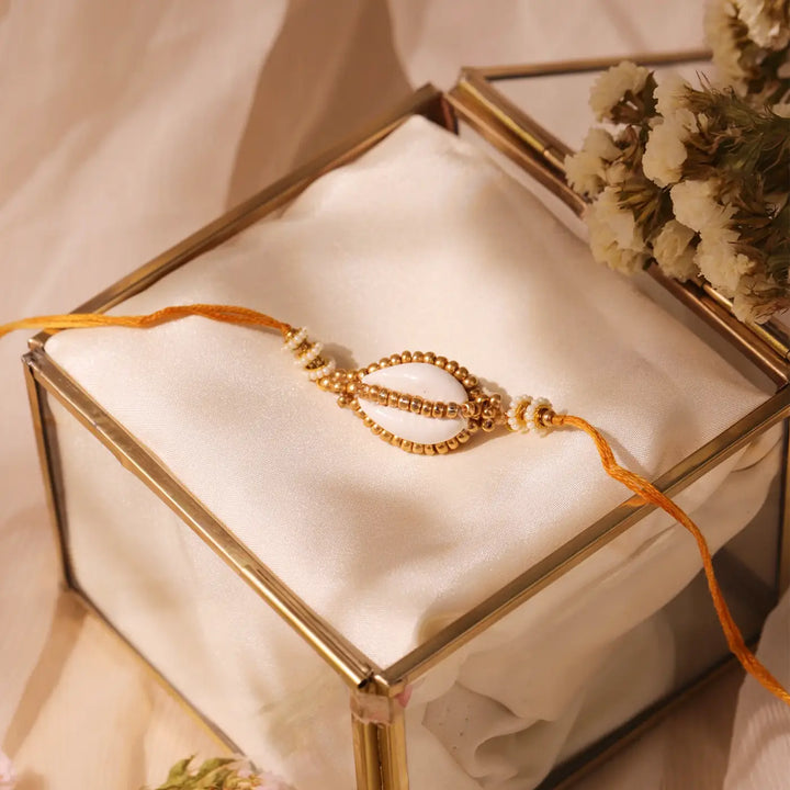 Handmade Beaded Golden Cowry Shell Rakhi With Roli Chawal