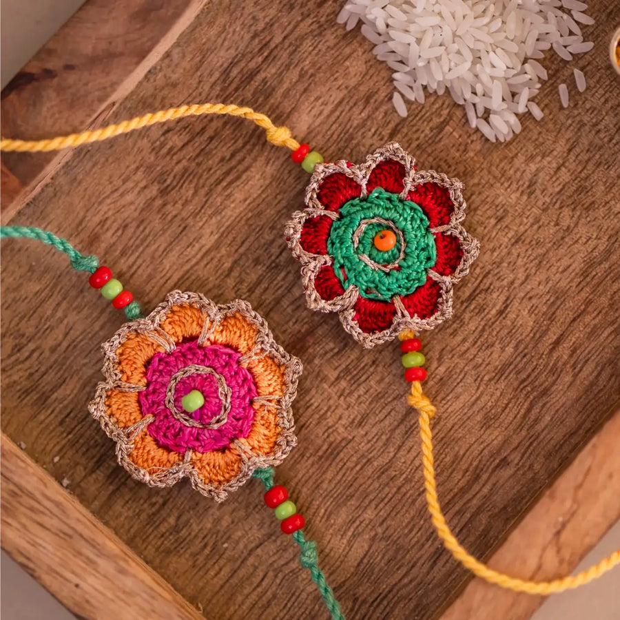 Handmade Crochet Champa Rakhi With Roli Chawal Set Of 2 - Close-up of Crochet Flower Bracelets