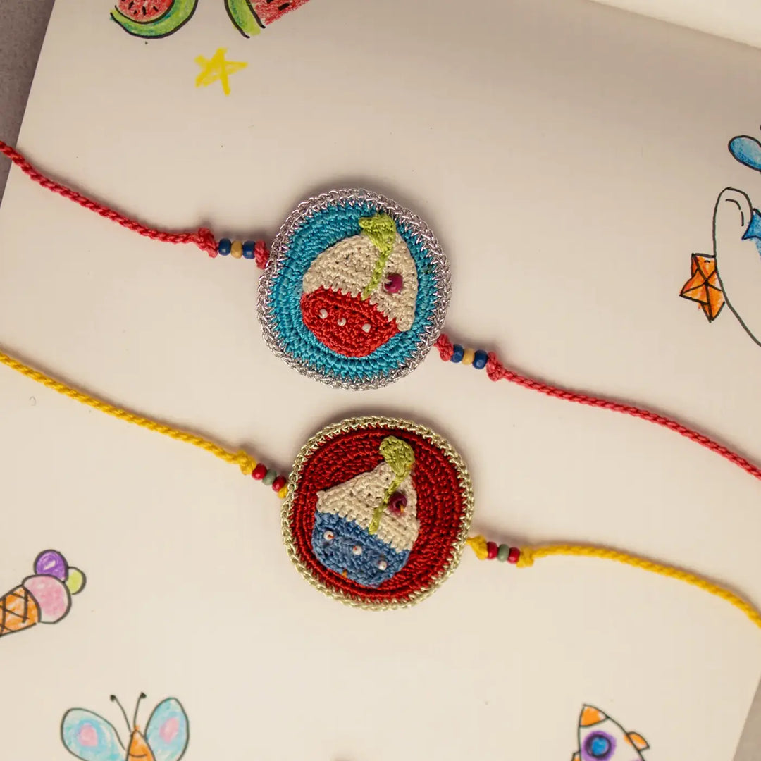Handmade Crochet Boat Theme Kids Rakhi With Roli Chawal Set Of 2 - Close-up of Two Bracelets