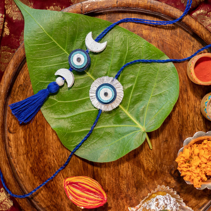 Nazarbattu Plantable Eco Friendly Handmade Cork Rakhi With Roli Chawal - Rakhis displayed on leaf and tray
