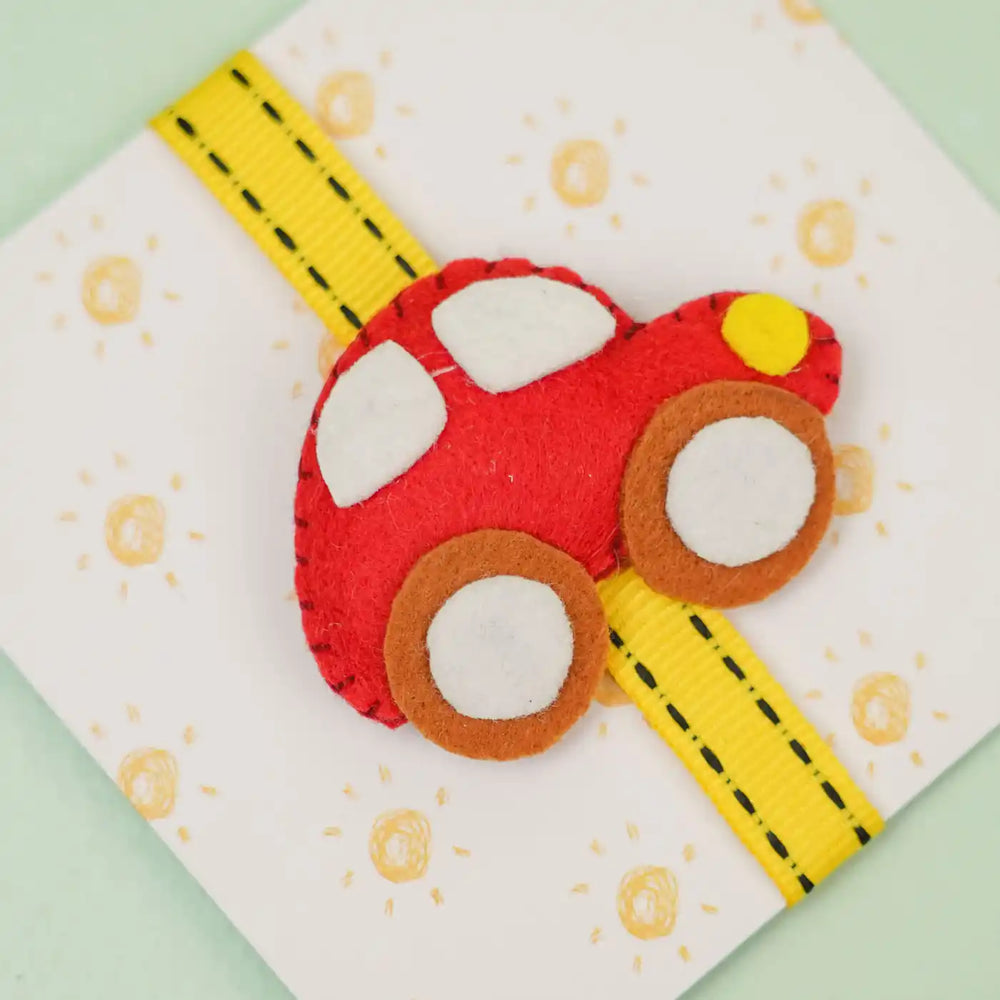 Handmade Car Theme Felt Kids Rakhi With Roli Chawal - Close-up on Red Car Decoration
