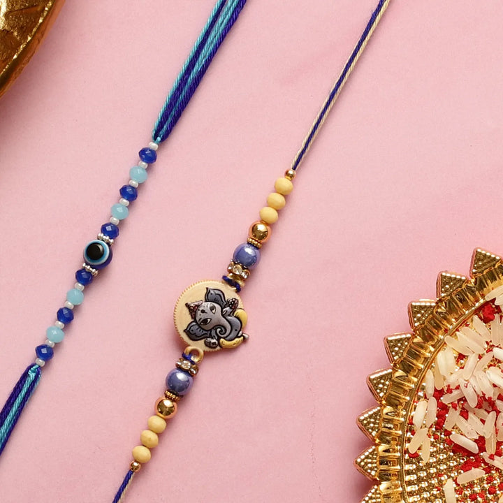 Handmade Ganesha & Evil Eye Kids Rakhi With Roli Chawal | Set Of 2