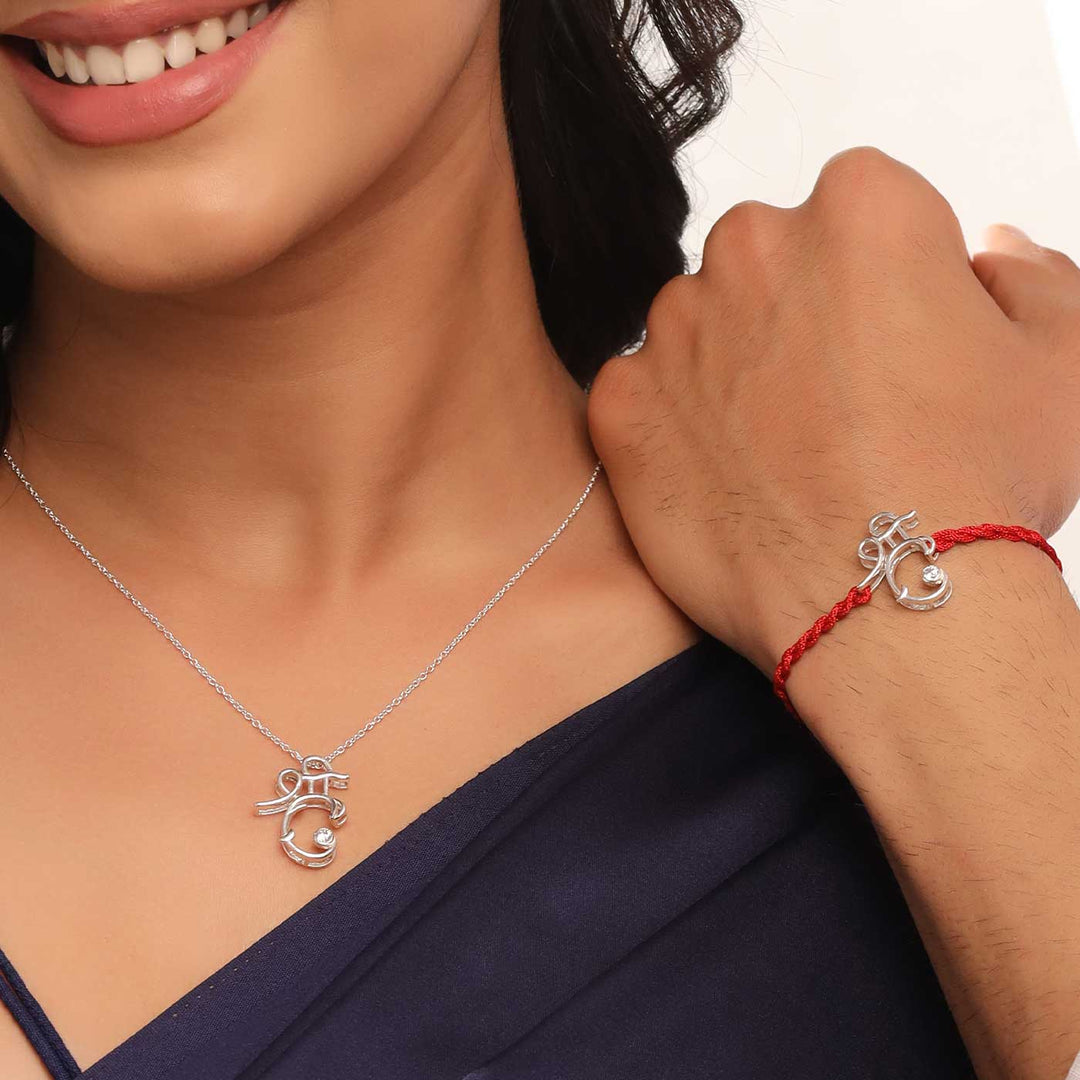 Handmade Shri Design Religious Silver Rakhi For Brother - Model Wearing Pendant and Rakhi