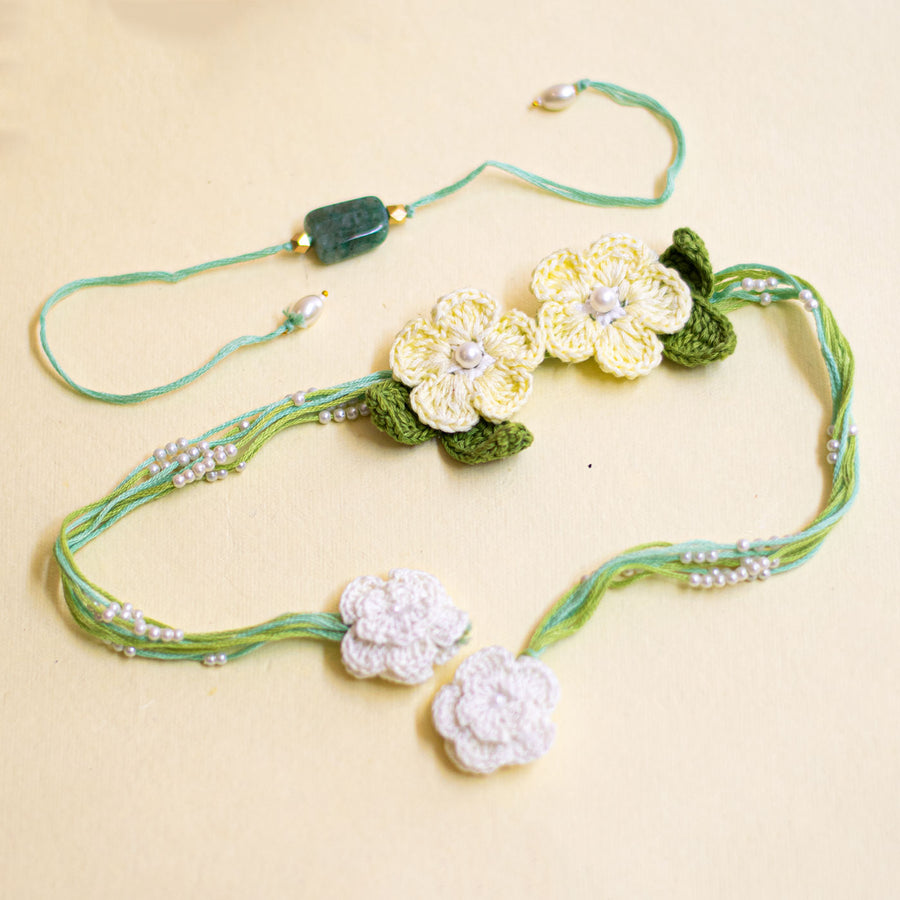 Handmade Reusable White Floral Bliss Bhaiya Bhabhi Rakhi With Roli Chawal - Two Floral Hair Accessories Front View