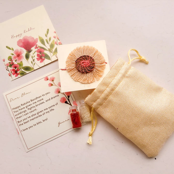 Eco Friendly Handmade White And Pink Pine Needle Rakhi With Pouch And Roli Chawal - Gift Set with Rakhi and Card