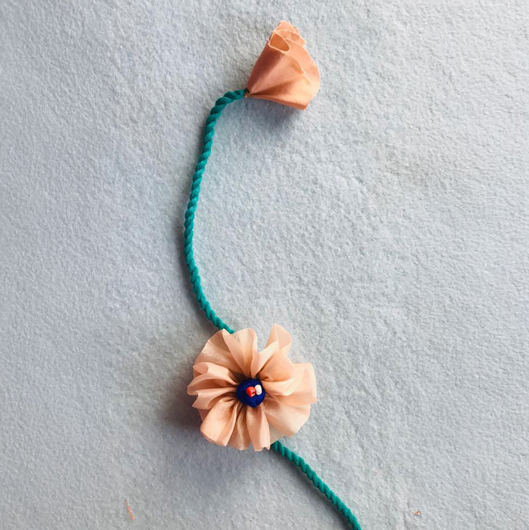 Handmade Beaded Daisy Flower Design Upcycled Fabric Rakhi With Roli Chawal For Brother - Single Floral Knot Band Front View (3)