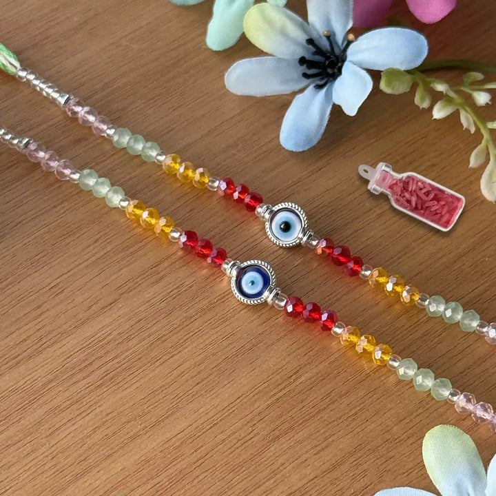 Handmade Round Beaded Evil Eye Rakhi With Roli Chawal - Laid Flat with Decoration
