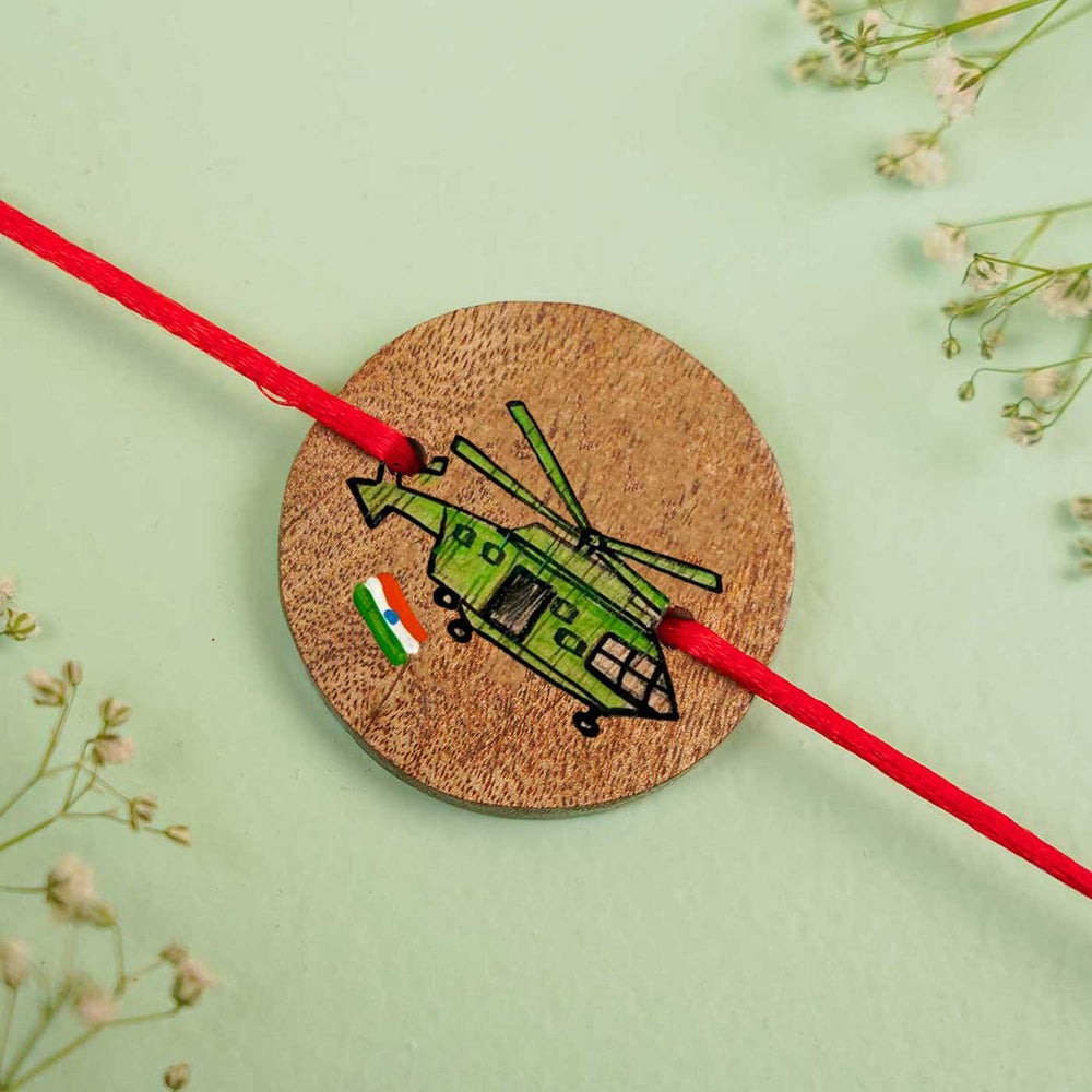 Personalized Hand Painted Helicopter Wooden Rakhi With Roli Chawal - Flat Lay Close-up View