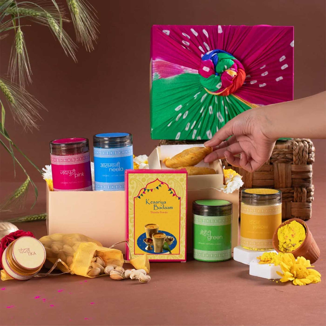 Hueful Holi Gift Hamper | Includes 1 Gujiya Pack, 1 Roasted Mix Dry Fruits, 1 Chandan Tika, 1 Kesariya Badaam Thandai, 4 Holi Colors, 1 Gift Box