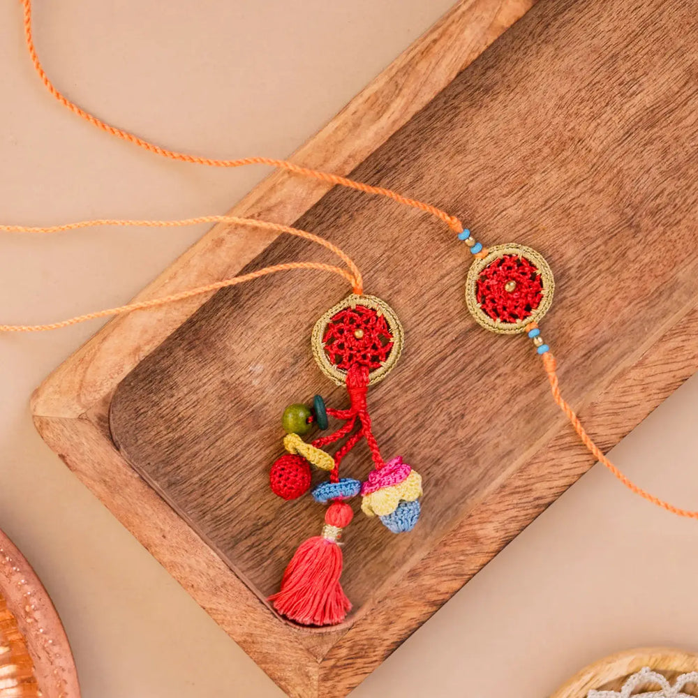 Handmade Crochet Dreamcatcher Bhaiya Bhabhi Rakhi With Roli Chawal Set Of 2 - Top View with Strings Laid Out