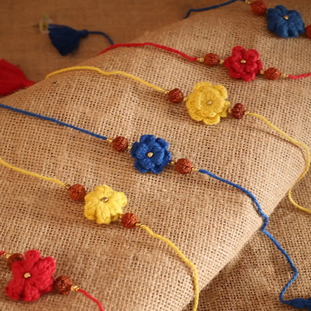 Handmade Crochet Flower And Rudraksh Rakhi With Roli Chawal Set Of 6 - Top Close-up Display