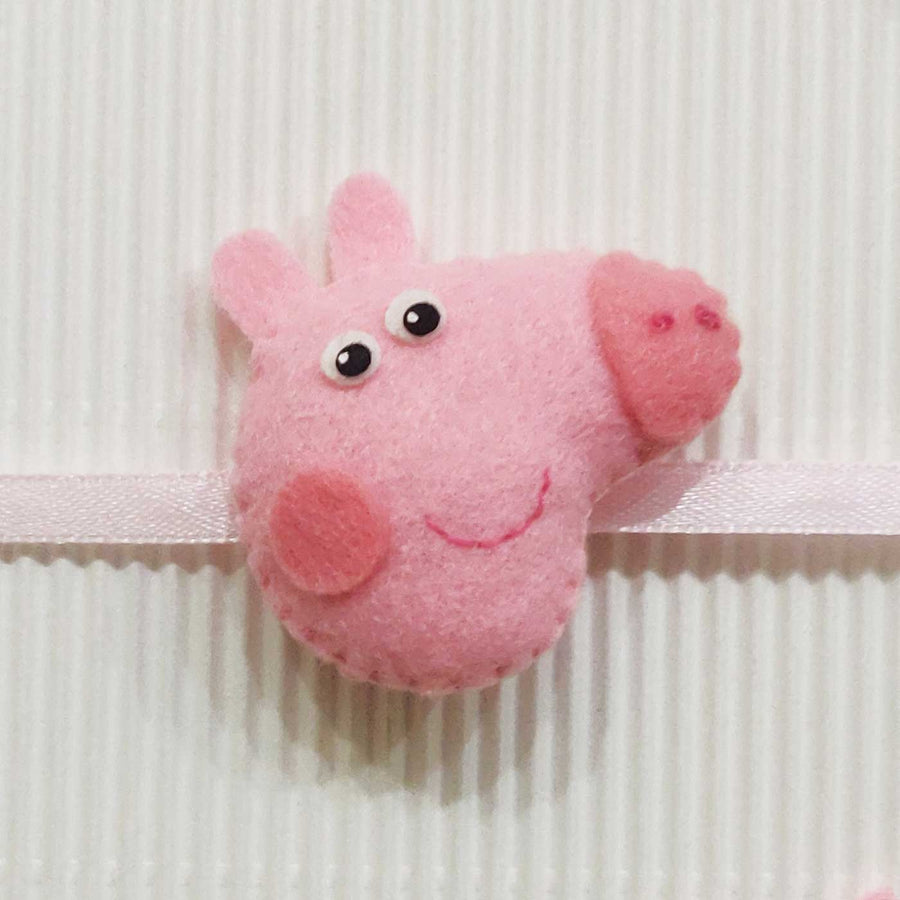 Handmade Peppa Pig Theme Felt Kids Rakhi With Roli Chawal - Close-up of Pink Character