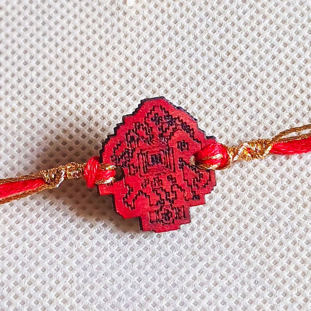Handmade Red Elephant Wooden Rakhi With Roli Chawal For Brother - Close-up of Pendant Detailing