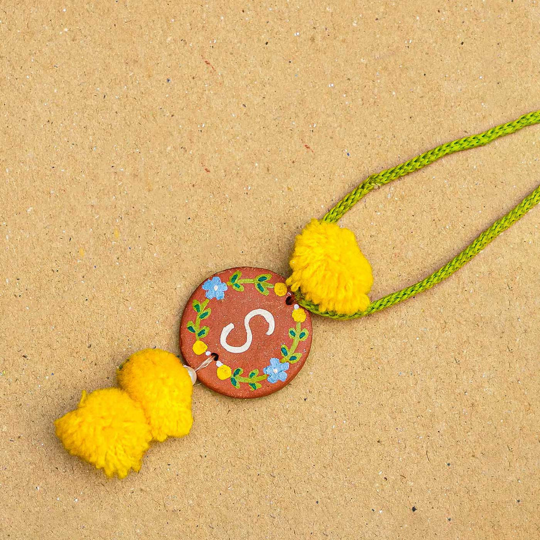 Personalised Initials Hand-Painted Terracotta Lumba Rakhi for Bhabhi With Roli Chawal