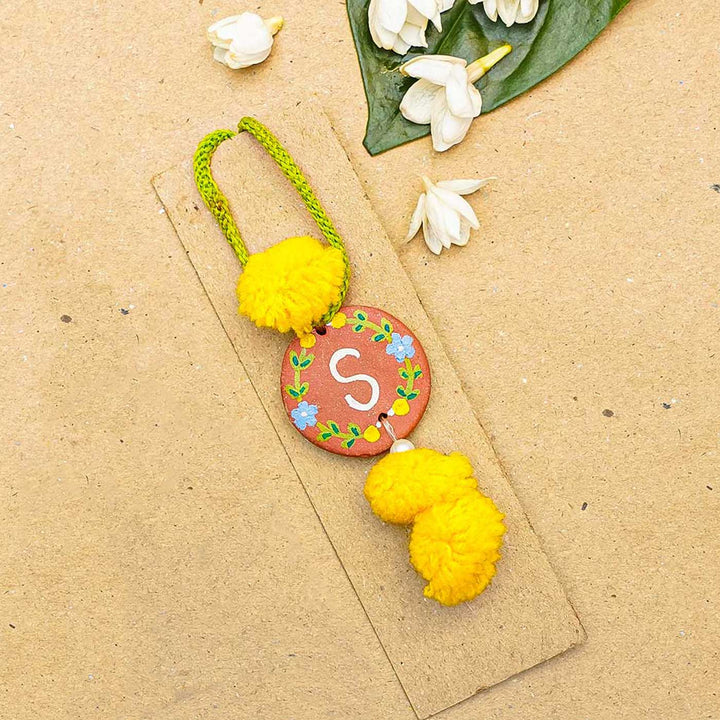 Personalised Initials Hand-Painted Terracotta Lumba Rakhi for Bhabhi With Roli Chawal
