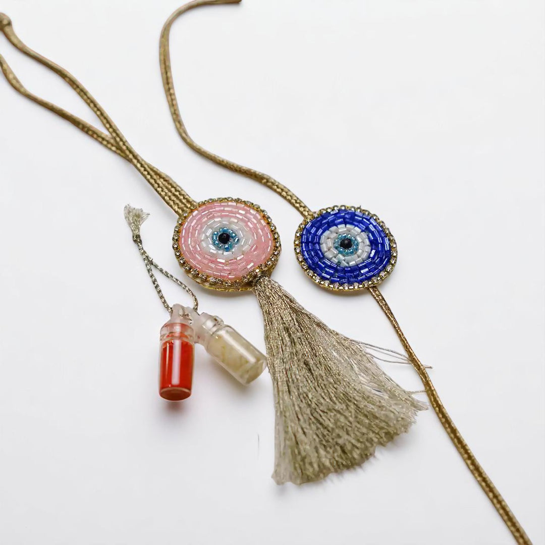 Handmade Beaded Evil Eye Bhaiya Bhabhi Rakhi With Roli Chawal Set Of 2 - Lying Flat with Bottles