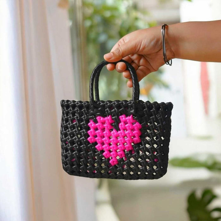 Handwoven Black Small Plastic Wire Koodai Bag With Pink Heart Motif For Festive Return Gifts