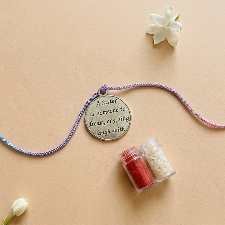 Engraved "A Sister Is Someone to Dream Cry Sing Laugh With" Quote Metal Charm Rakhi With Roli Chawal for Brother