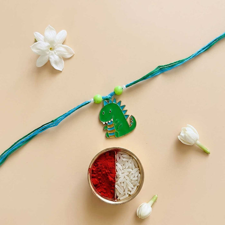 Engraved Little Dinosaur Enamel Metal Charm Rakhi With Roli Chawal for Brother