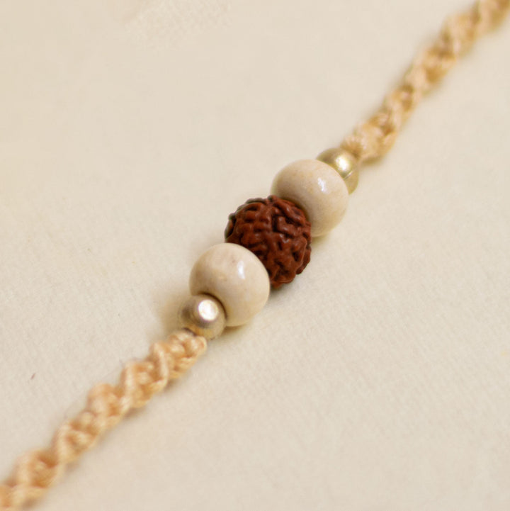 Handmade Pearl Rudraksha Rakhi With Roli Chawal - Macro Bead Detail