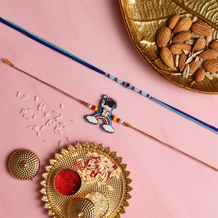 Handmade Beaded Astronaut & Evil Eye Kids Rakhi With Roli Chawal | Set Of 2