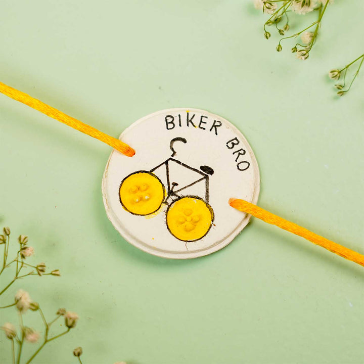 Personalized Hand Painted Biker Bro Clay Rakhi With Roli Chawal - Close-up Front View Isolated