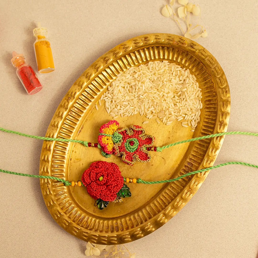 Handmade Crochet Pankhuri Rakhi With Roli Chawal Set Of 2 - Flat Lay Styled Display