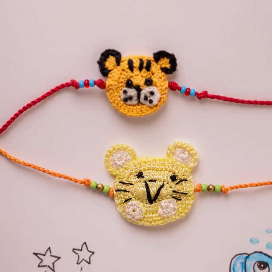 Handmade Crochet Cat And Tiger Theme Kids Rakhi With Roli Chawal Set Of 2 - Close-up of bracelet charms