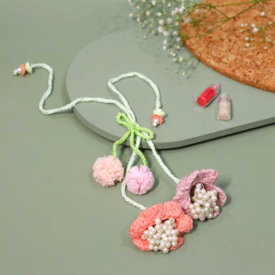 Handmade Crochet Forever Flowers Kids Rakhi With Roli Chawal Copy - Close-up of crochet flower necklace