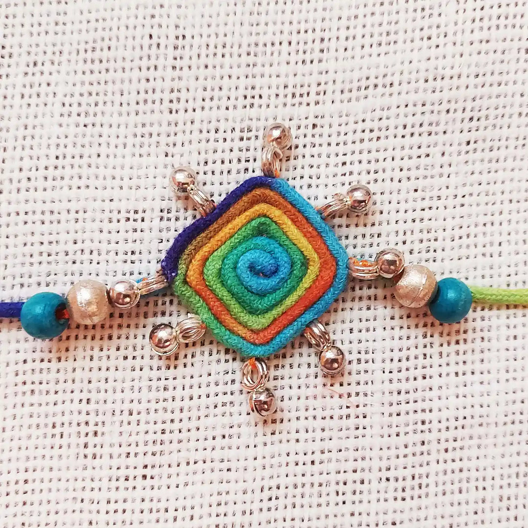 Handmade Dori Work Beaded Multicolor Rakhi With Roli Chawal - Close-up of Central Pendant