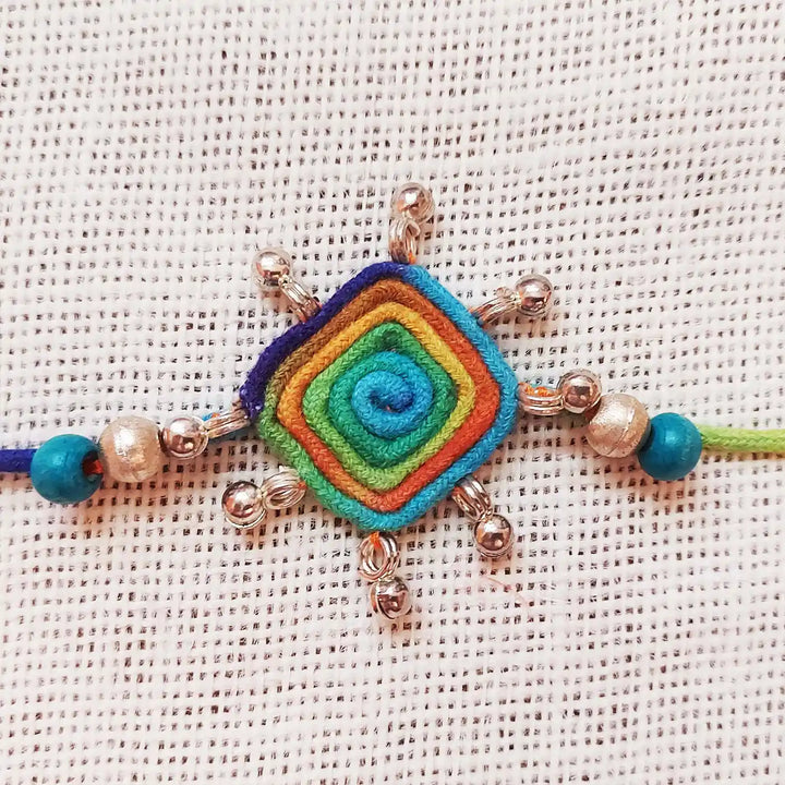 Handmade Dori Work Beaded Multicolor Rakhi With Roli Chawal - Close-up of Central Pendant
