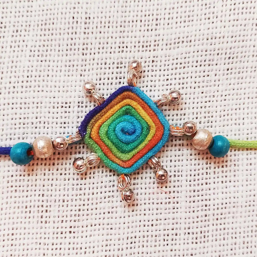 Handmade Dori Work Beaded Multicolor Rakhi With Roli Chawal - Close-up of Central Pendant