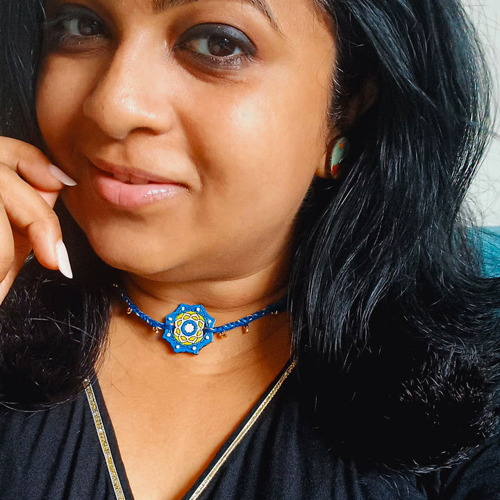Handmade Blue Jaipuri Ghungroo And Shell Beads Wooden Lumba Rakhi For Bhabhi With Roli Chawal - Worn Necklace on Model
