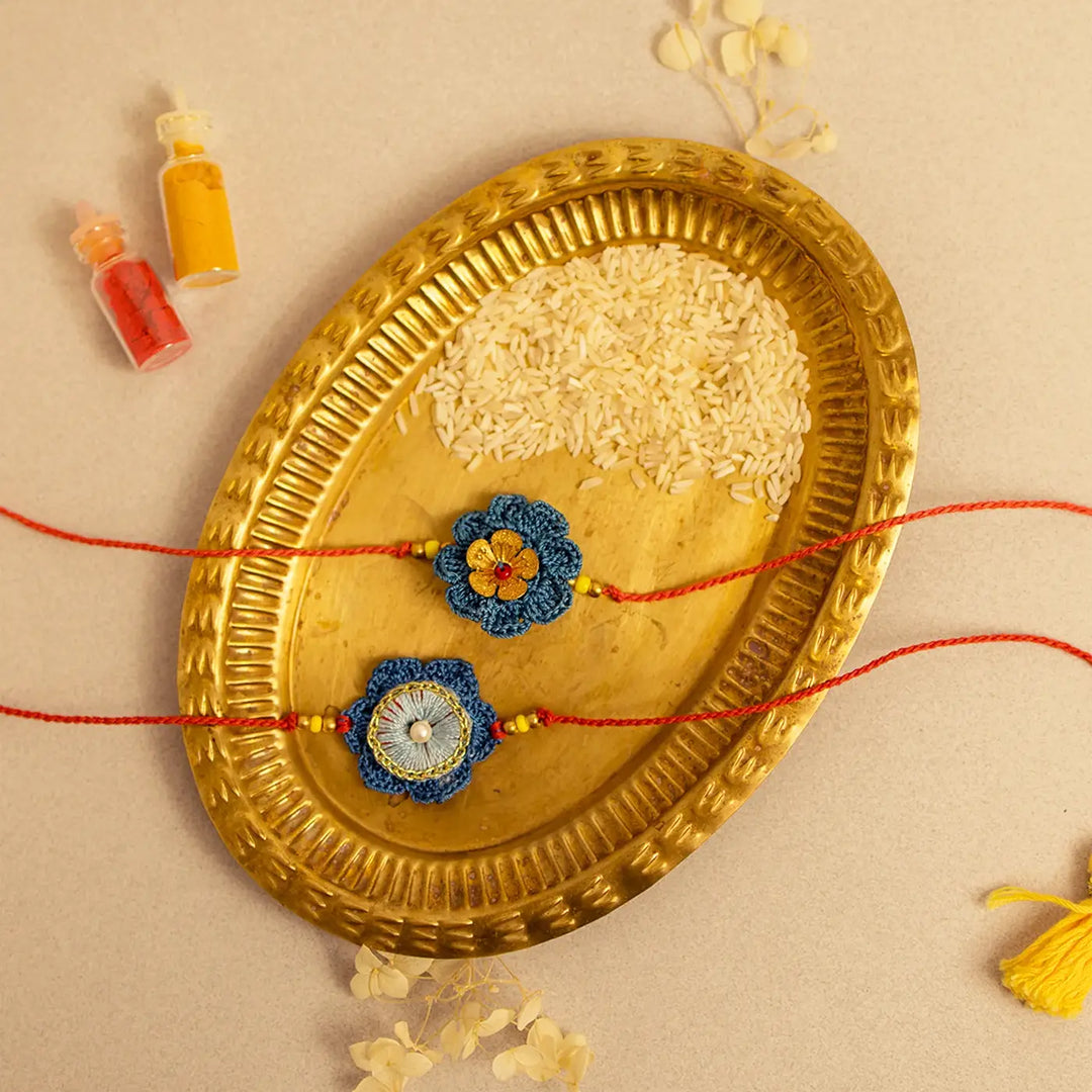 Handmade Crochet Neelam Flower Rakhi With Roli Chawal Set Of 2 - Top view with tassel details