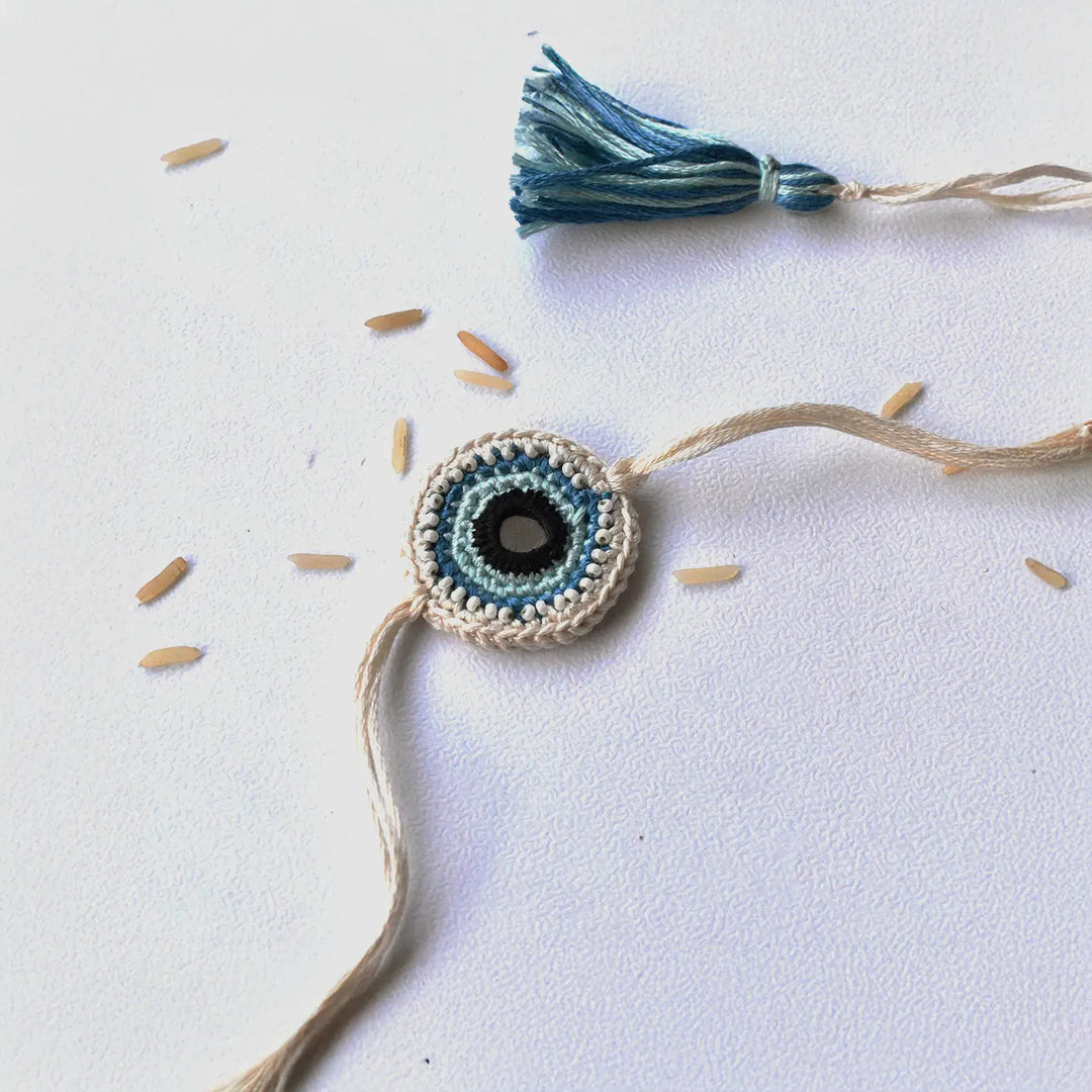 Handmade Crochet Blue Evil Eye Rakhi With Roli Chawal