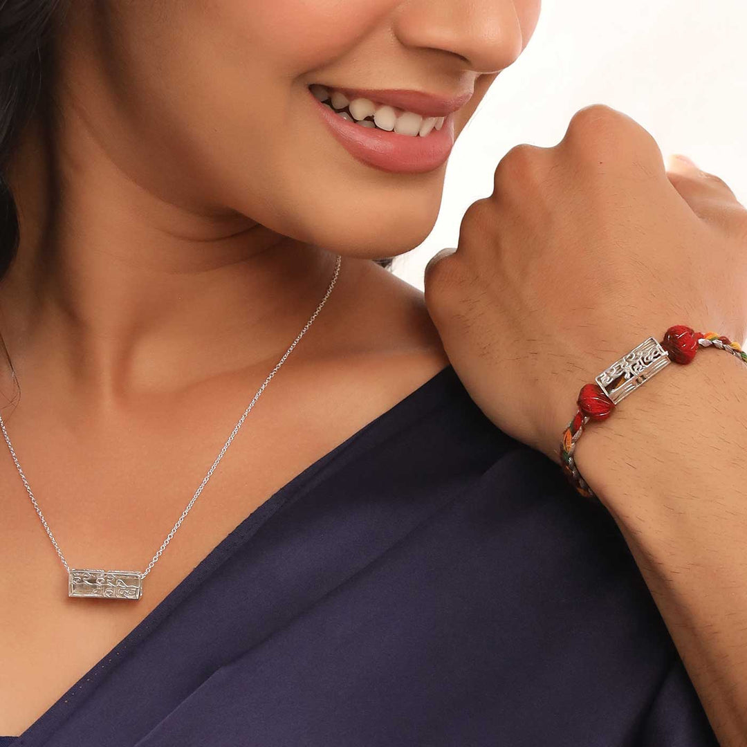 Handmade Har Har Mahadev Design Religious Silver Rakhi For Brother - Model wearing necklace and bracelet