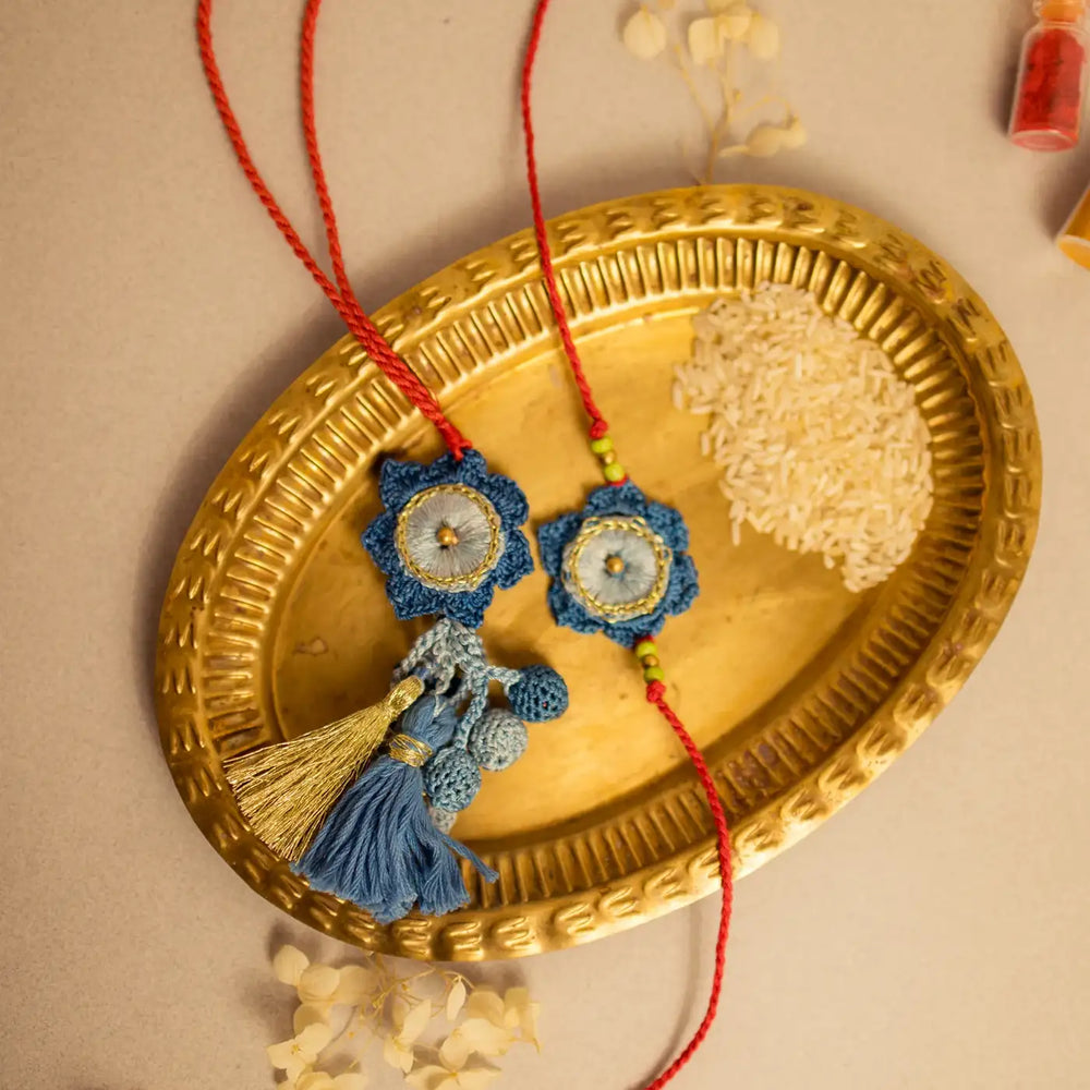 Handmade Crochet Neelkamal Bhaiya Bhabhi Rakhi With Roli Chawal Set Of 2 - Styled with Decorative Tray