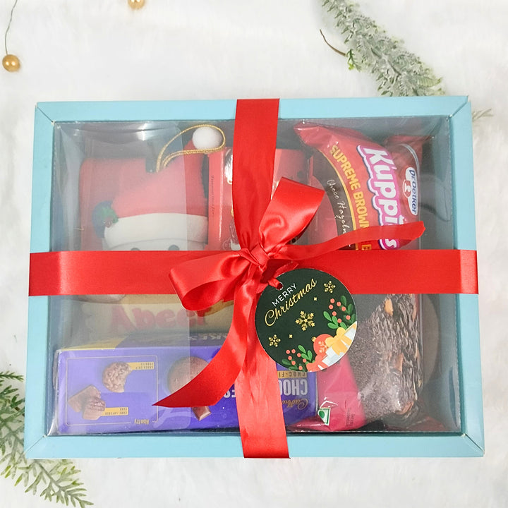 Personalized Christmas Gift Hamper | Includes 1 Ornament, 1 Stocking, 1 Snowman Candle, 1 Brownie Cake, 1 Cadbury Chocobakes, 1 Nutties Pack